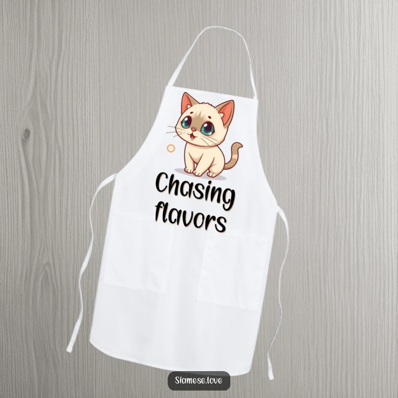 Funny apron featuring a surprised kawaii Siamese cat intensely chasing a red laser dot, perfect for kitchen focus.
