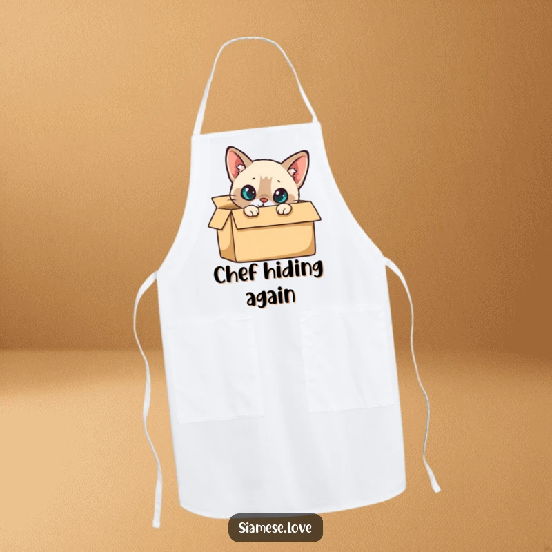 Funny Apron: A curious Siamese cat peeking out from a cardboard box, ready to help in the kitchen.