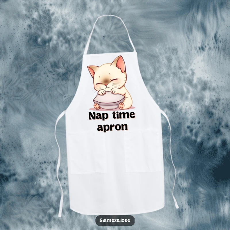 Funny Siamese cat apron showing a cute kawaii kitty nuzzling a small cushion, ideal for kitchen fun and cat lover chefs.