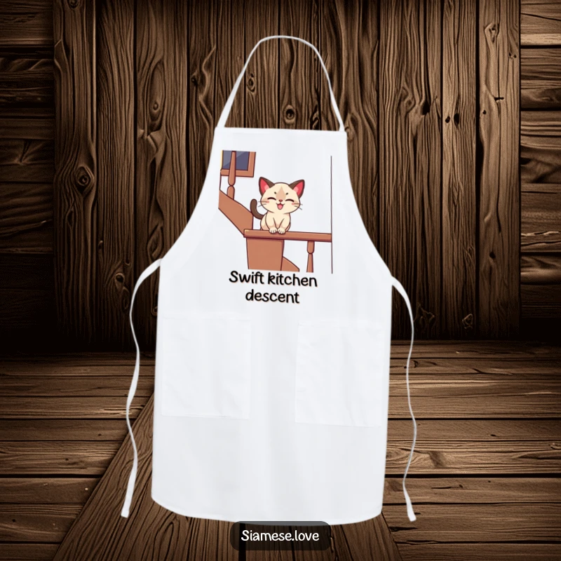 Funny apron with a stylized Siamese cat playfully sliding down a banister with a joyful expression, perfect for kitchen fun and as a humorous gift.