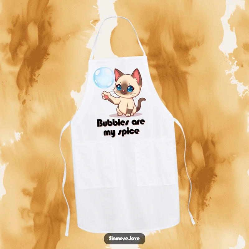 Funny Siamese cat character batting a floating bubble on a kitchen apron, bringing playful vibes.