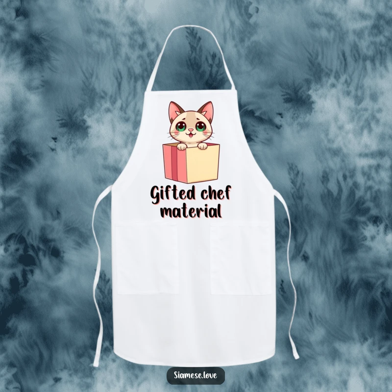 Funny Siamese cat emerging from a gift box with a surprised expression on a kitchen apron, adding playful flair.