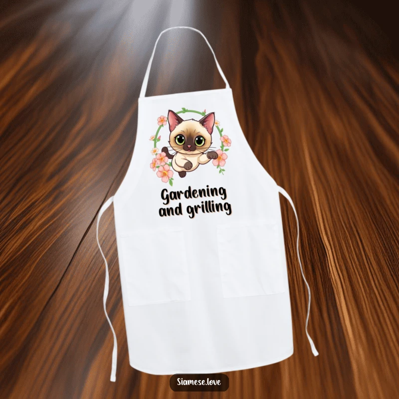 Funny apron featuring a curious Siamese cat leaping through a hoop of flowers, perfect for kitchen adventures with feline grace and style.