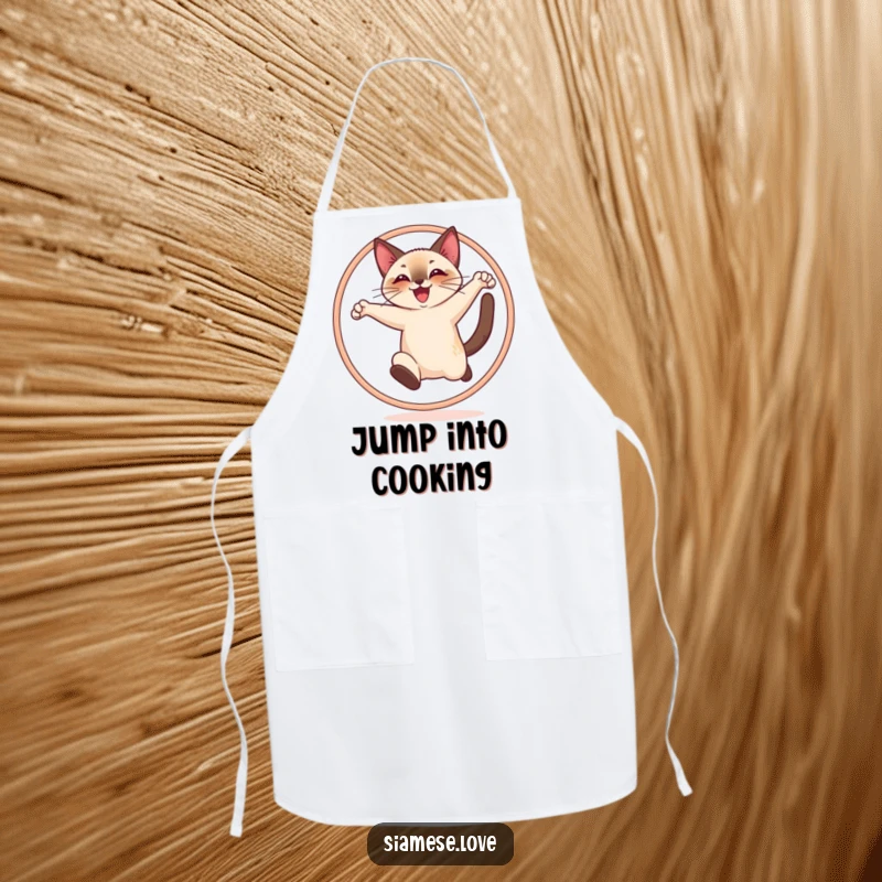 Funny apron showing a cheerful Siamese cat joyfully leaping through a hoop, perfect for a fun-loving cook.