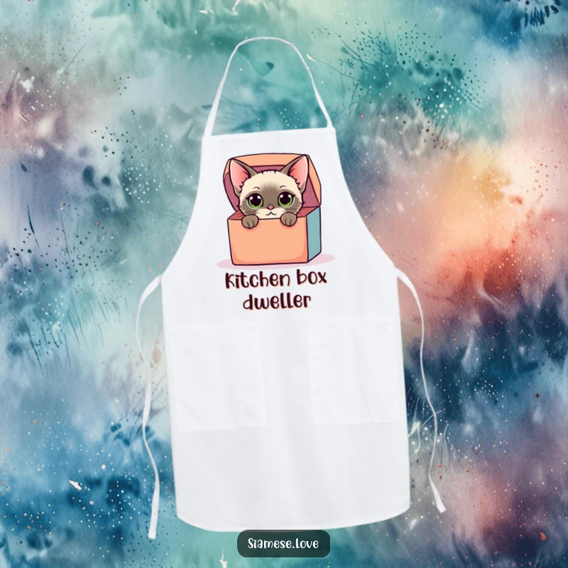 Funny apron with a stylized Siamese cat with curious eyes peeking from a colorful oversized box, perfect for kitchen fun and as a humorous gift.
