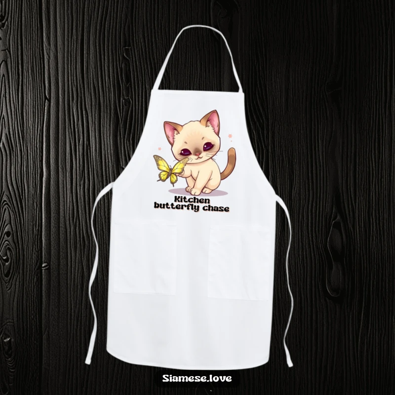 Funny Kawaii Siamese Cat Apron: Whimsical cat playfully pouncing on a shimmering butterfly, perfect for a fun kitchen.