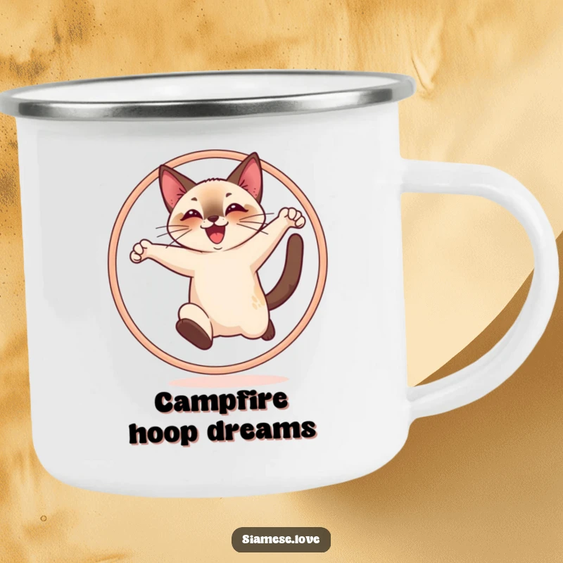 Funny camping mug with a cheerful Siamese cat joyfully leaping through a hoop, perfect for adventurers.