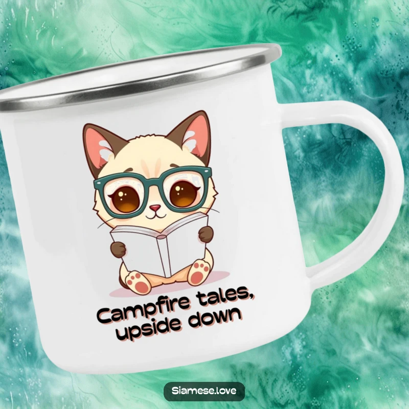 Funny Siamese cat camping mug, a cat in oversized glasses reads an upside-down book, ready for outdoor escapades.