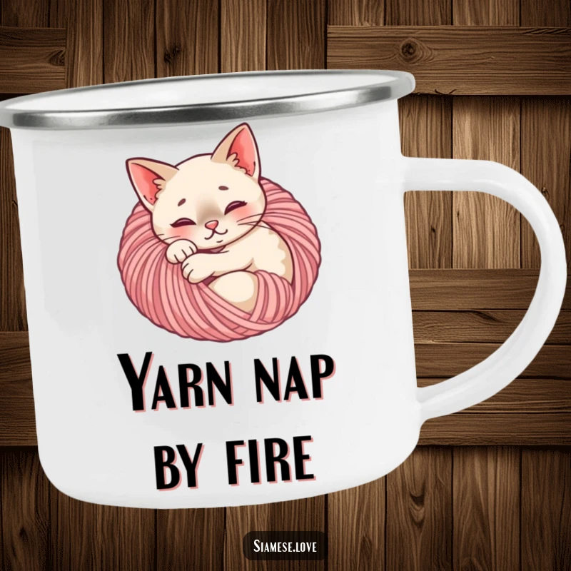 Funny Siamese cat camping mug depicting a content feline curled up in a yarn ball, designed for cozy outdoor enjoyment.
