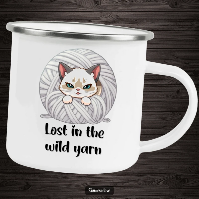 Funny camping mug featuring a mischievous Siamese cat hiding behind yarn. Durable and humorous drinkware.