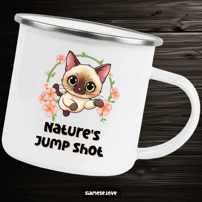 Funny camping mug featuring a curious Siamese cat leaping through a hoop of flowers, ready for outdoor adventures with feline grace and style.