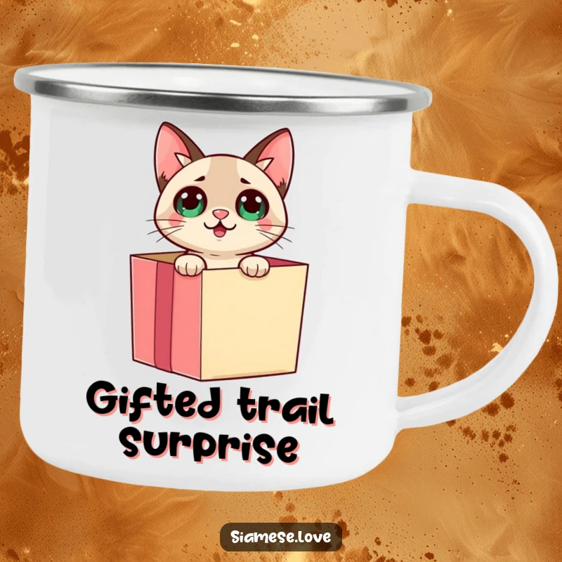 Funny Siamese cat emerging from a gift box with a surprised look on a metal camping mug, perfect for adventure and smiles.