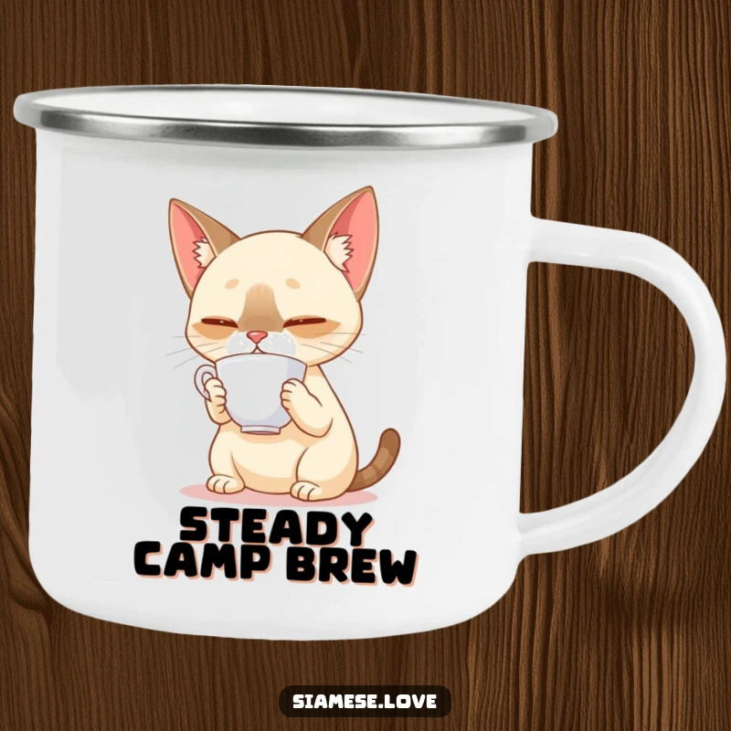 Funny Siamese cat balancing a teacup on its nose on a metal camping mug, ideal for outdoor tea breaks with humor.