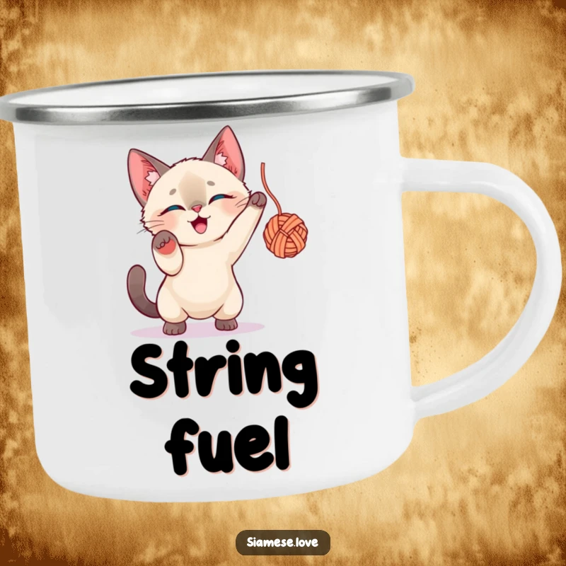 Funny Siamese Cat Camping Mug: A energetic Siamese cat character playing with a ball of yarn in an outdoor setting.