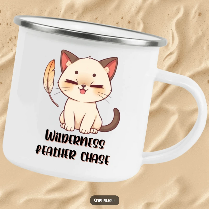 Funny cute Siamese cat camping mug with a mischievous grin, batting at a feather, charming and humorous for outdoor enjoyment.