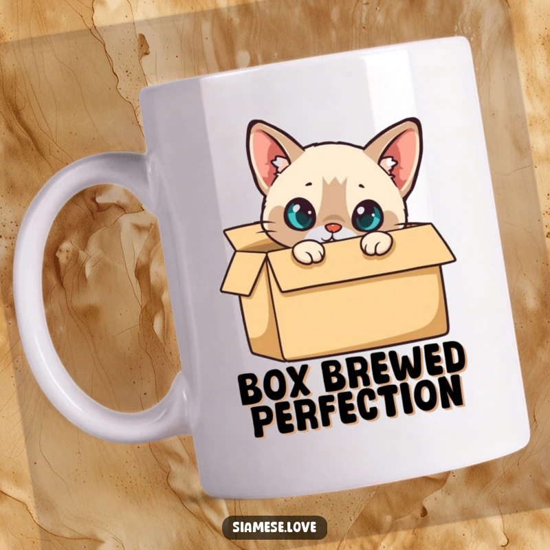 Funny Mug: A curious Siamese cat peeking its head out from a cardboard box, with wide, inquisitive eyes.
