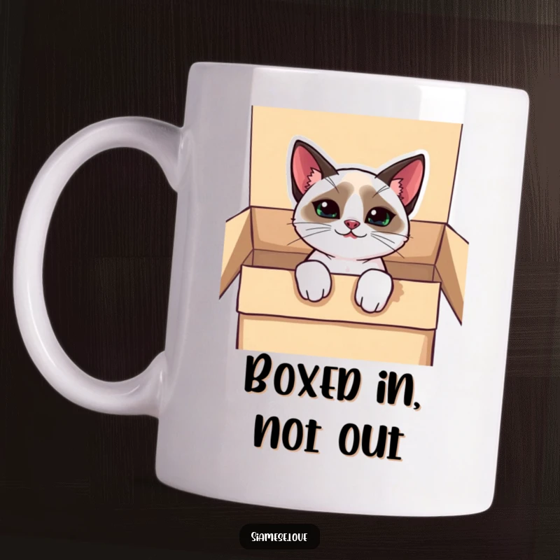 Funny kawaii Siamese cat mug, peeking mischievously from a box with a sly grin, adding playful charm.