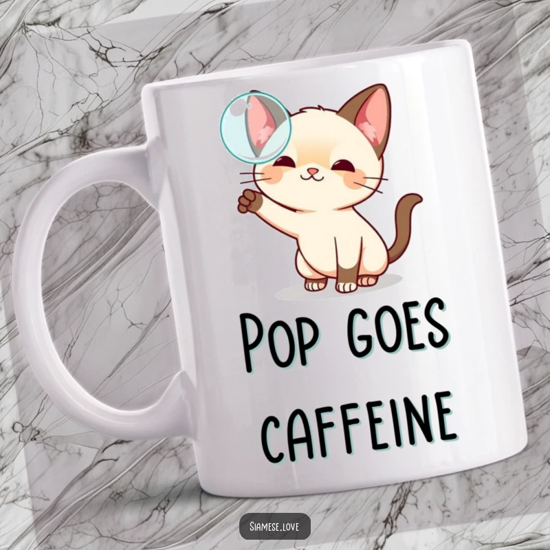 Funny kawaii Siamese cat mug, playfully swatting at a floating bubble with curious paws, embodying innocent fun.