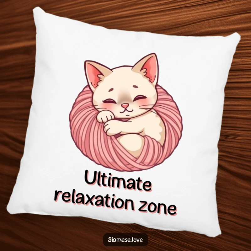 Funny Siamese cat pillow displaying a content feline curled up cozily in a ball of yarn, offering comfort and charm.