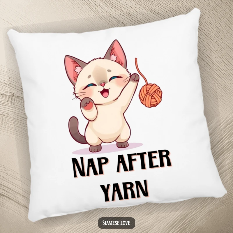 Funny Siamese Cat Pillow: A cute Siamese cat character batting with all its might at a stray ball of yarn.