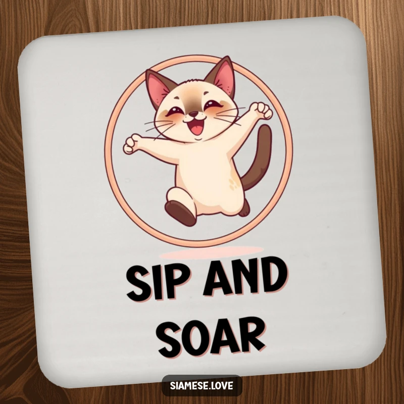 Funny drink coaster featuring a cheerful Siamese cat joyfully leaping through a hoop, adding humor to drinks.