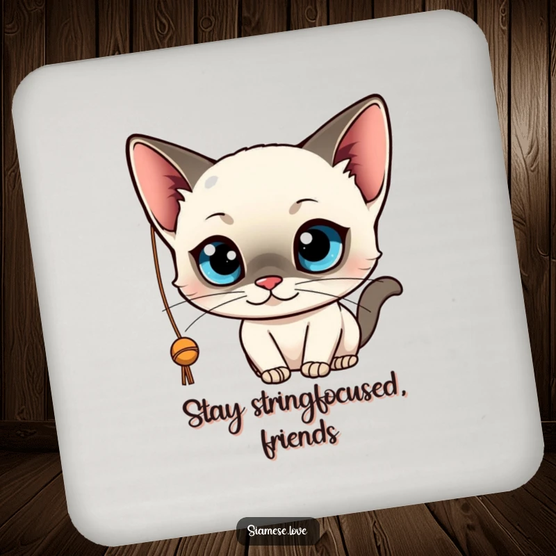 Funny drink coaster featuring a kawaii Siamese cat with big blue eyes, playfully batting at a string. Protects surfaces with charm.