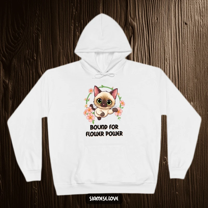 Funny hoodie featuring a curious Siamese cat leaping through a hoop of flowers, offering warmth and a touch of feline elegance and whimsy.