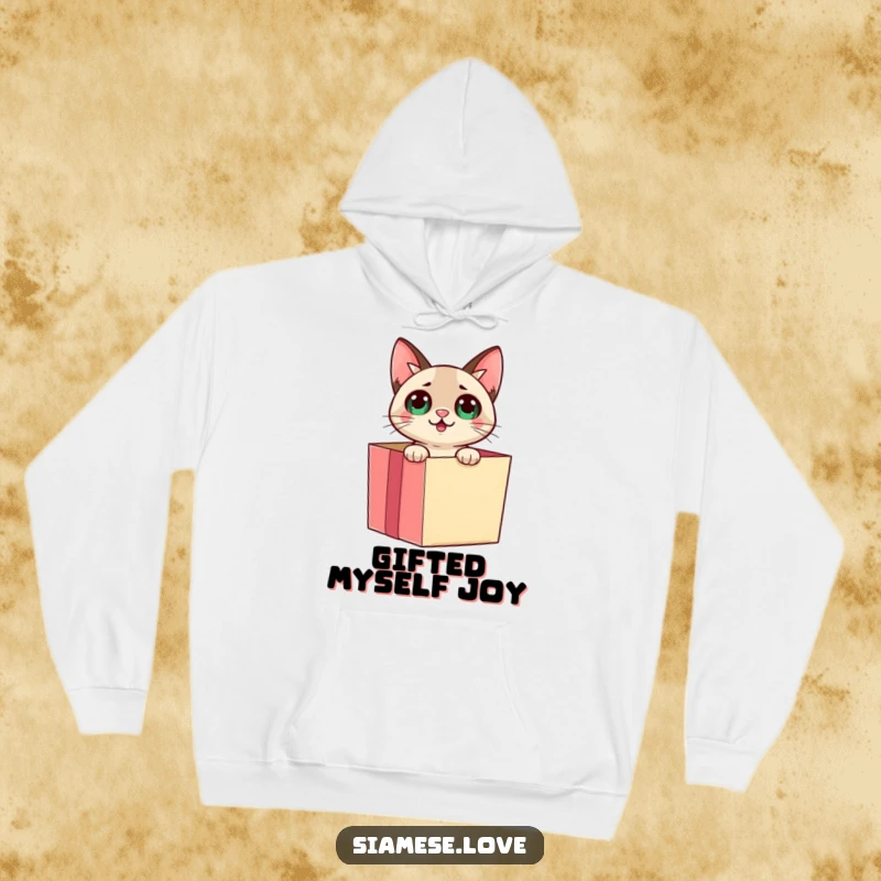 Funny Siamese cat emerging from a gift box with a surprised look on a cozy hoodie, radiating playful energy.