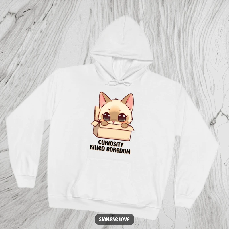Funny Siamese Cat Hoodie: A curious Siamese cat with wide eyes peers into a small box, offering cozy humor.