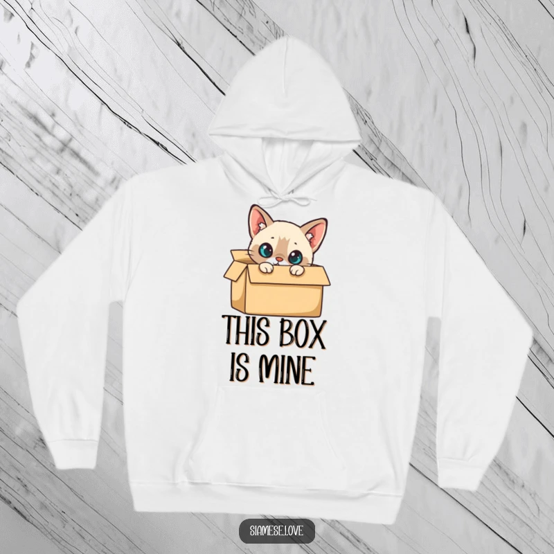 Funny Hoodie: A Siamese cat curiously peeking from a cardboard box, embodying playful curiosity and comfort.