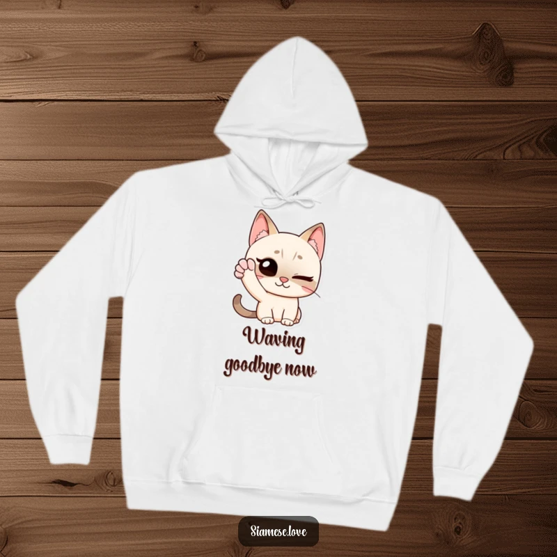 Funny hoodie with a Siamese cat character winking and giving a friendly wave with its paw, designed to spread cheer and warmth.