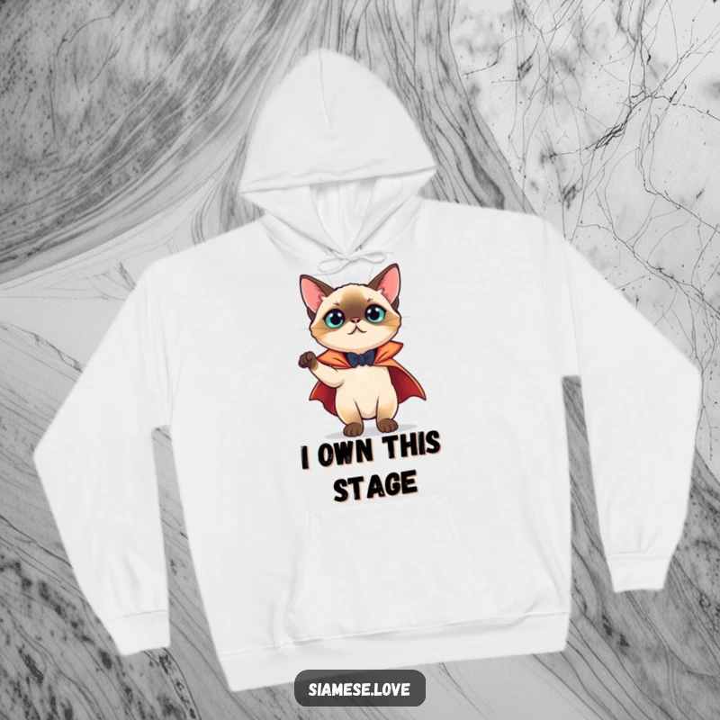 Funny Hoodie: A theatrical Siamese cat sporting a tiny cape, striking a dramatic and hilarious pose, radiating charm.