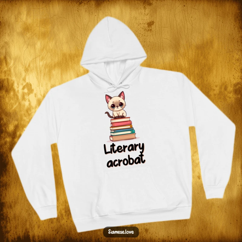 Funny Kawaii Siamese cat balancing precariously on a stack of books on a soft, warm hoodie, perfect for cozy reading.