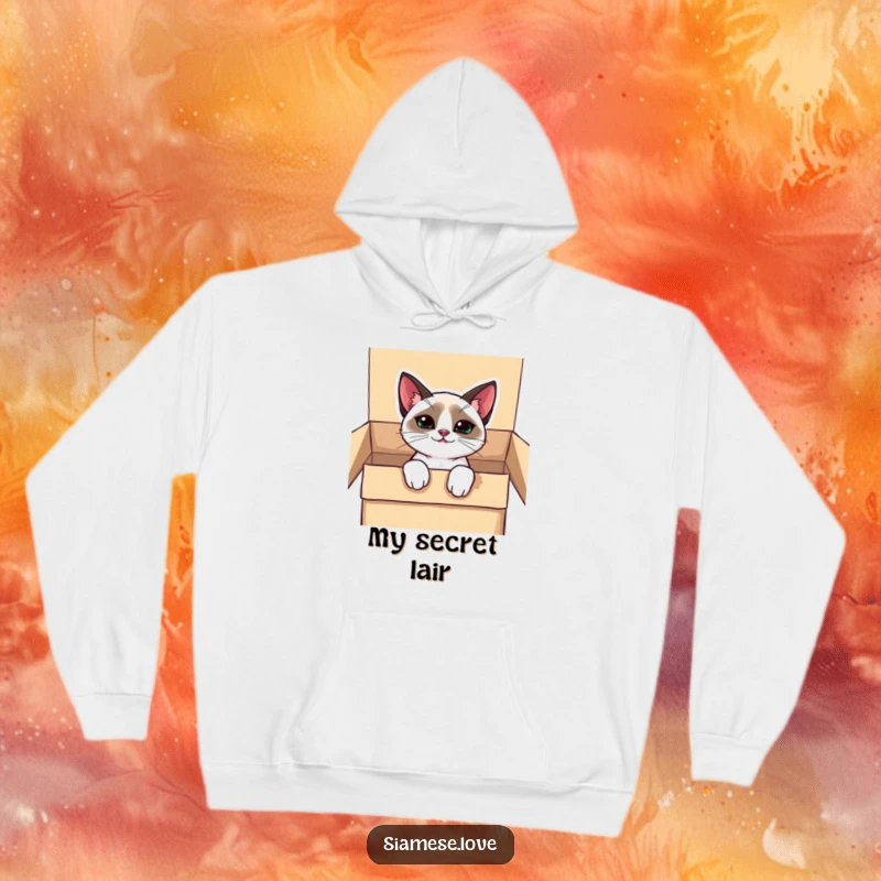 Funny kawaii Siamese cat hoodie, peeking from a box with a mischievous grin, offering cozy comfort and playful vibes.