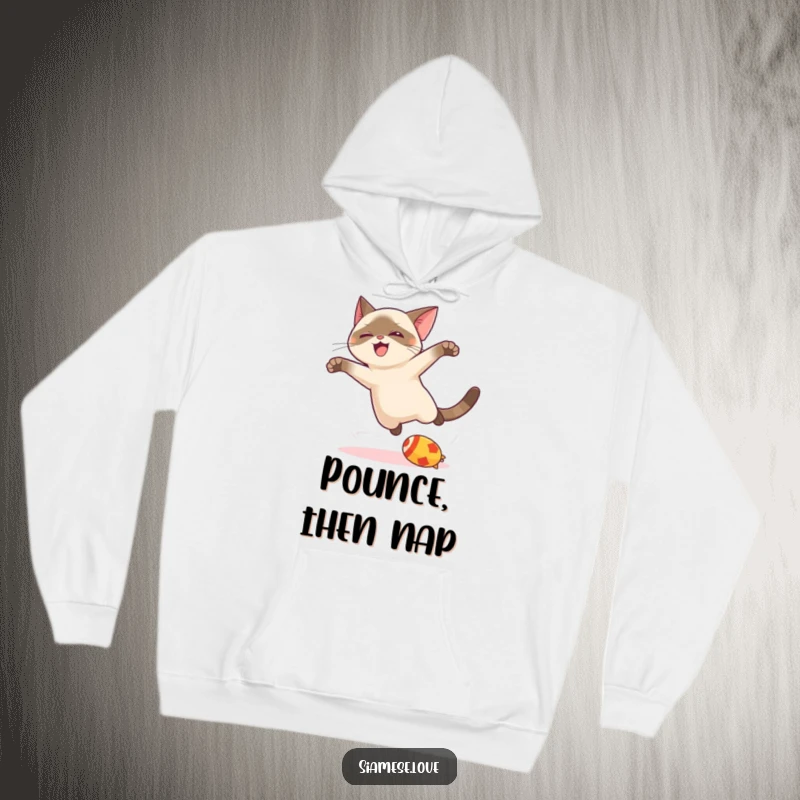 Funny kawaii Siamese cat hoodie, depicted in a joyful leap towards a toy, radiating playful energy and cute charm.