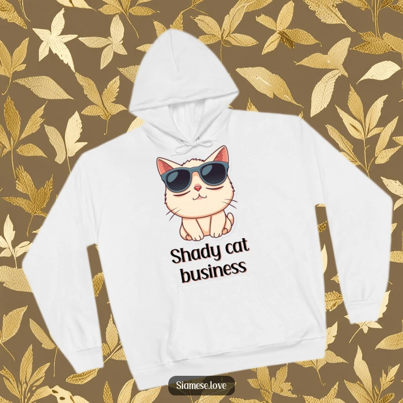 Funny Siamese cat character comically wearing oversized sunglasses, featured on a cozy hoodie.