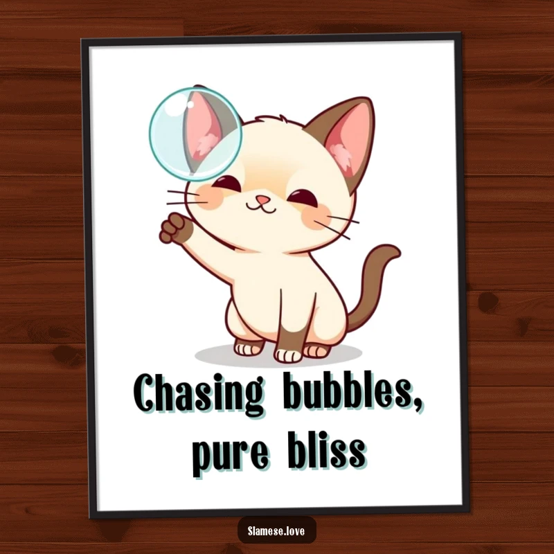 Funny Free Printable Wall Art depicting a cute kawaii Siamese cat playfully swatting at a shimmering floating bubble with sheer enjoyment.