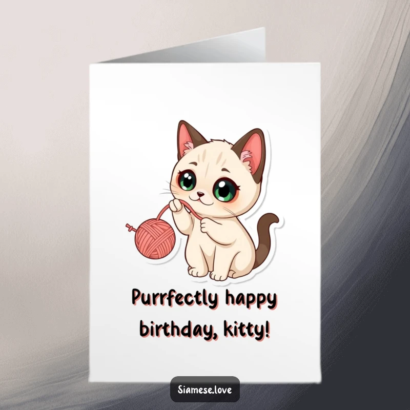 Funny Free Printable Birthday Card: Kawaii Siamese cat batting at a yarn ball with wide eyes, playful and humorous.