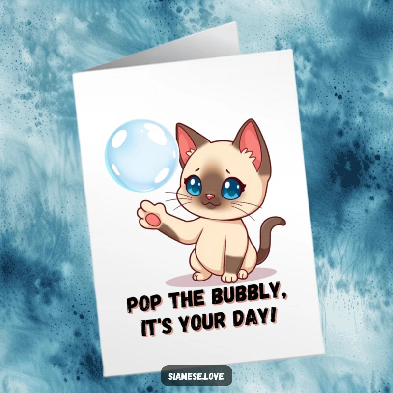 Funny Free Printable Birthday Card: Curious Siamese cat playfully batting a floating bubble with its paw.