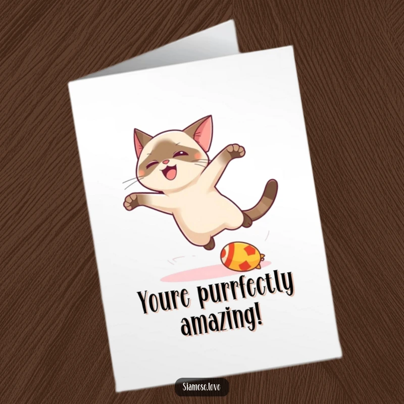 Funny Free Printable Birthday Card with a kawaii Siamese cat joyfully leaping for a toy, ready to celebrate.
