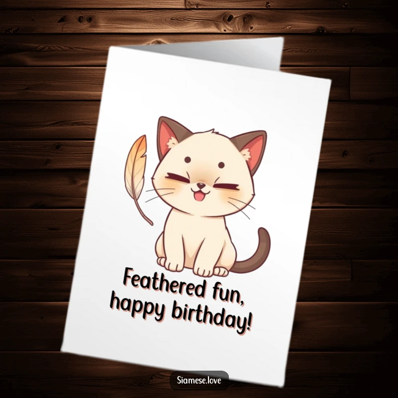 Funny Free Printable Birthday Card: A cute Siamese cat with a mischievous grin batting at a feather.