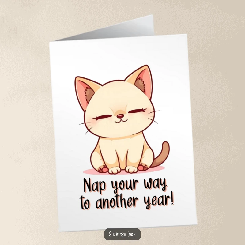 Free Printable Birthday Card: Adorable Kawaii Siamese cat blissfully sleeping in a sunbeam, smiling peacefully.