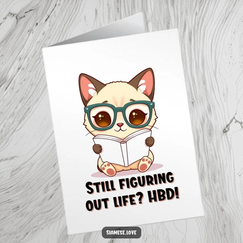 Funny Free Printable Birthday Card: Siamese cat in oversized glasses, reading a book upside down with a confused yet studious look.