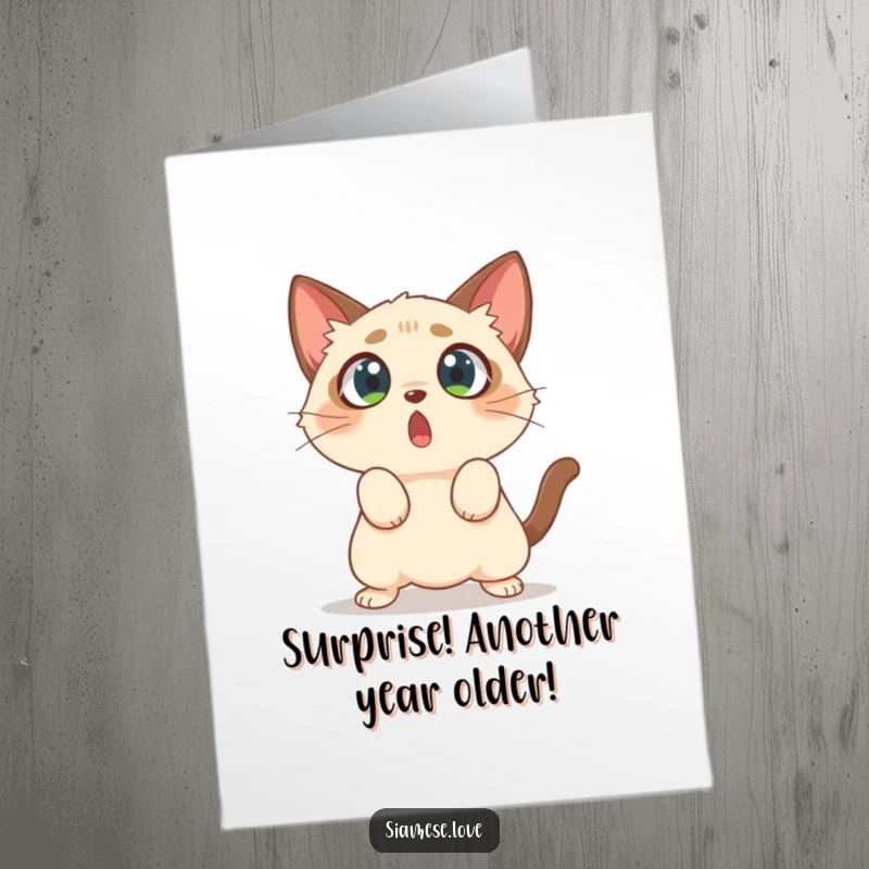 Funny Free Printable Siamese cat character with wide eyes, comically pouncing on empty air for a birthday.