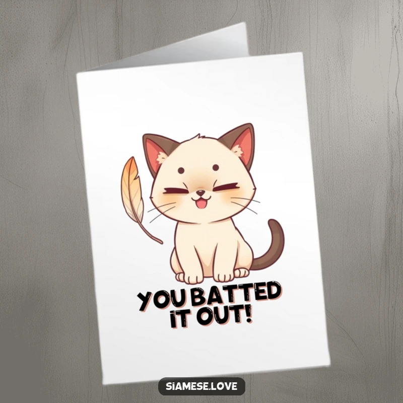 Funny Free Printable Congratulations Card: A cute Siamese cat with a mischievous grin batting playfully at a feather.