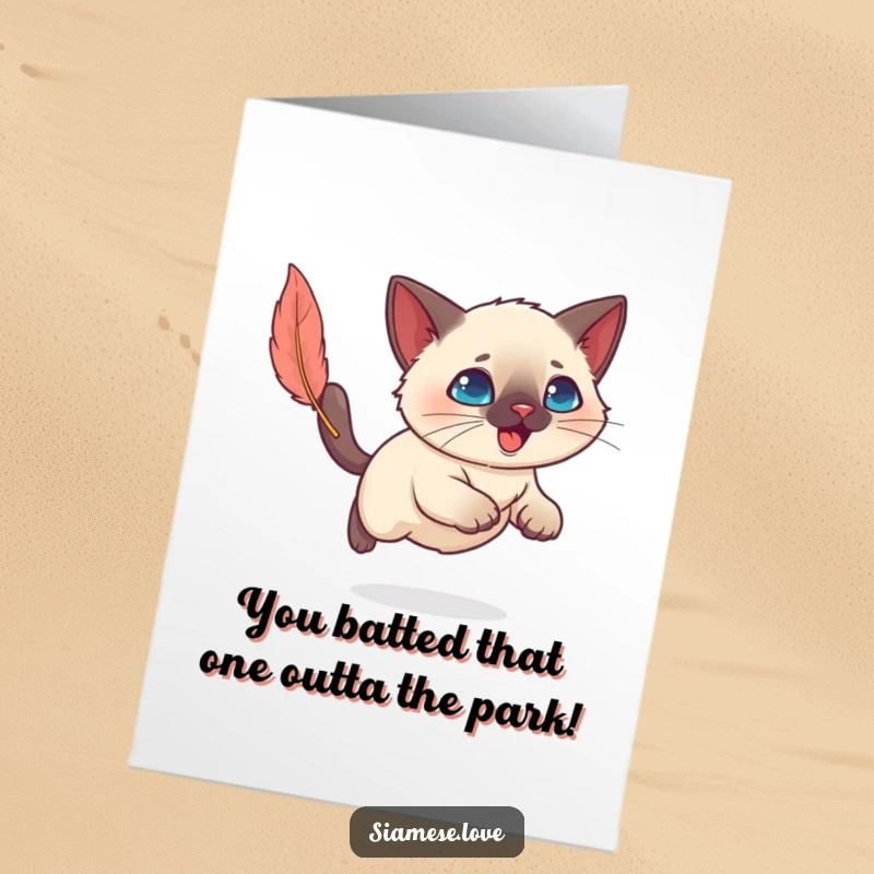 Funny Free Printable Congratulations Card: A gleeful Kawaii Siamese cat leaps for a feather, symbolizing exciting achievements.