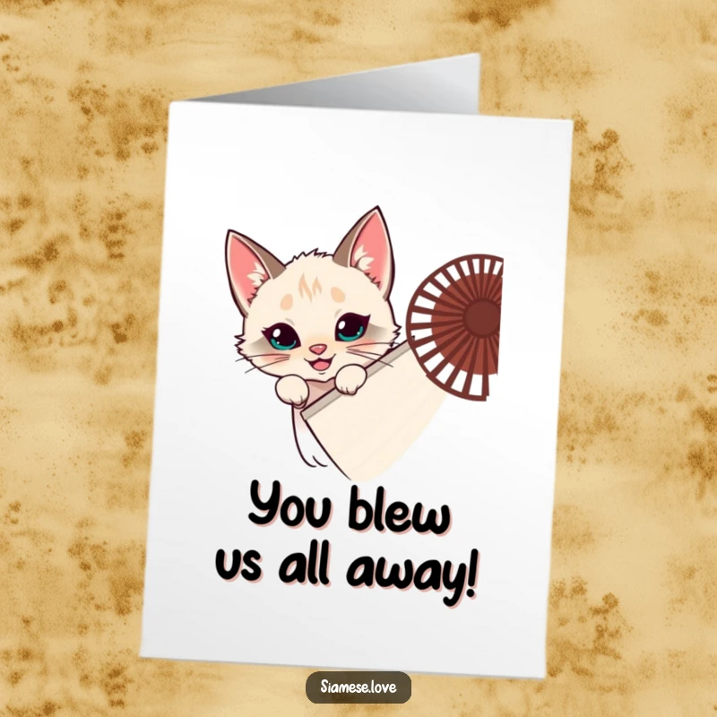 Funny Free Printable Congratulations Card: Siamese cat hiding behind a large fan, peeking out with a mischievous grin, celebrating success.