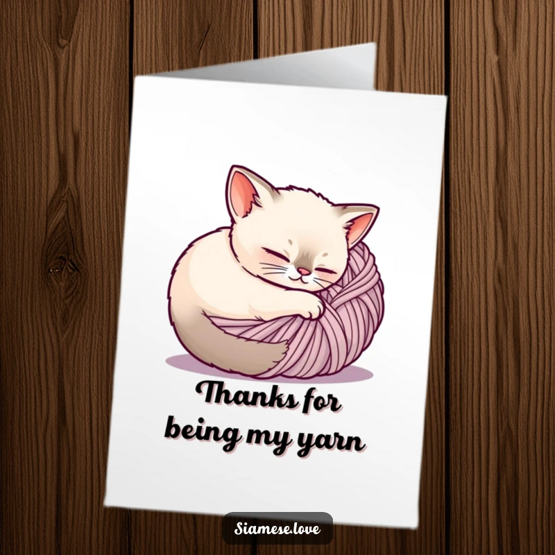 Cute Free Printable Thank You Card: A content Siamese cat snuggled in a ball of yarn, sending warm thanks.