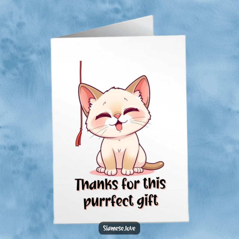 Funny Free Printable Thank You Card: A playful Siamese cat batting at a string, conveying thanks with adorable mischief.