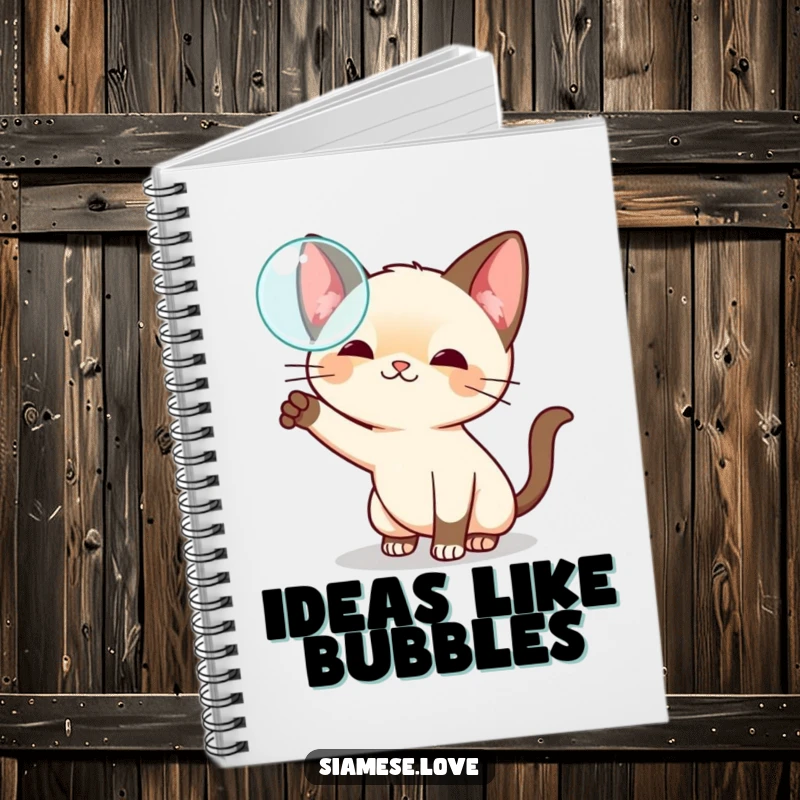 Funny kawaii Siamese cat notebook, playfully swatting at a floating bubble, perfect for jotting down creative thoughts.